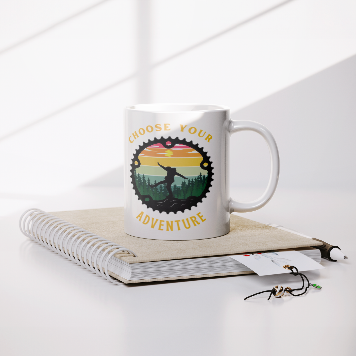 Choose_Your_Adventure_11oz_White_Mug_Lifestyle_Notebook_Mockup.png