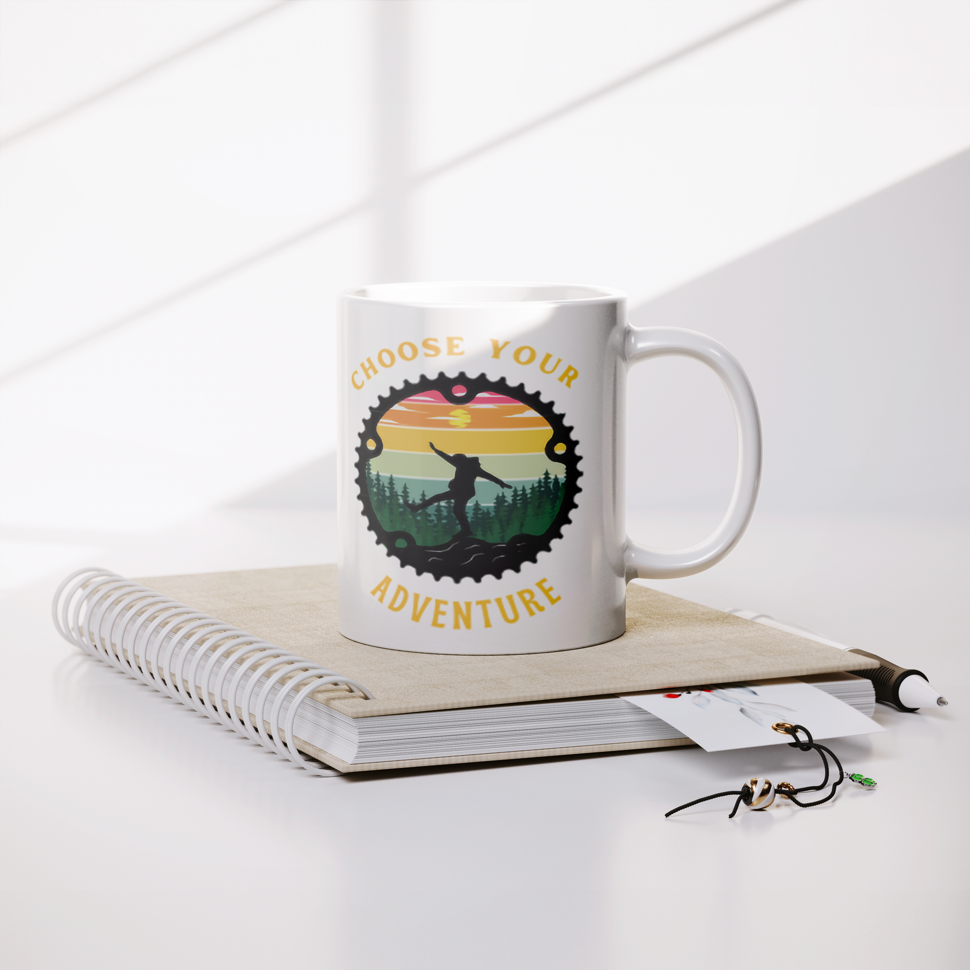 Choose_Your_Adventure_11oz_White_Mug_Lifestyle_Notebook_Mockup.png