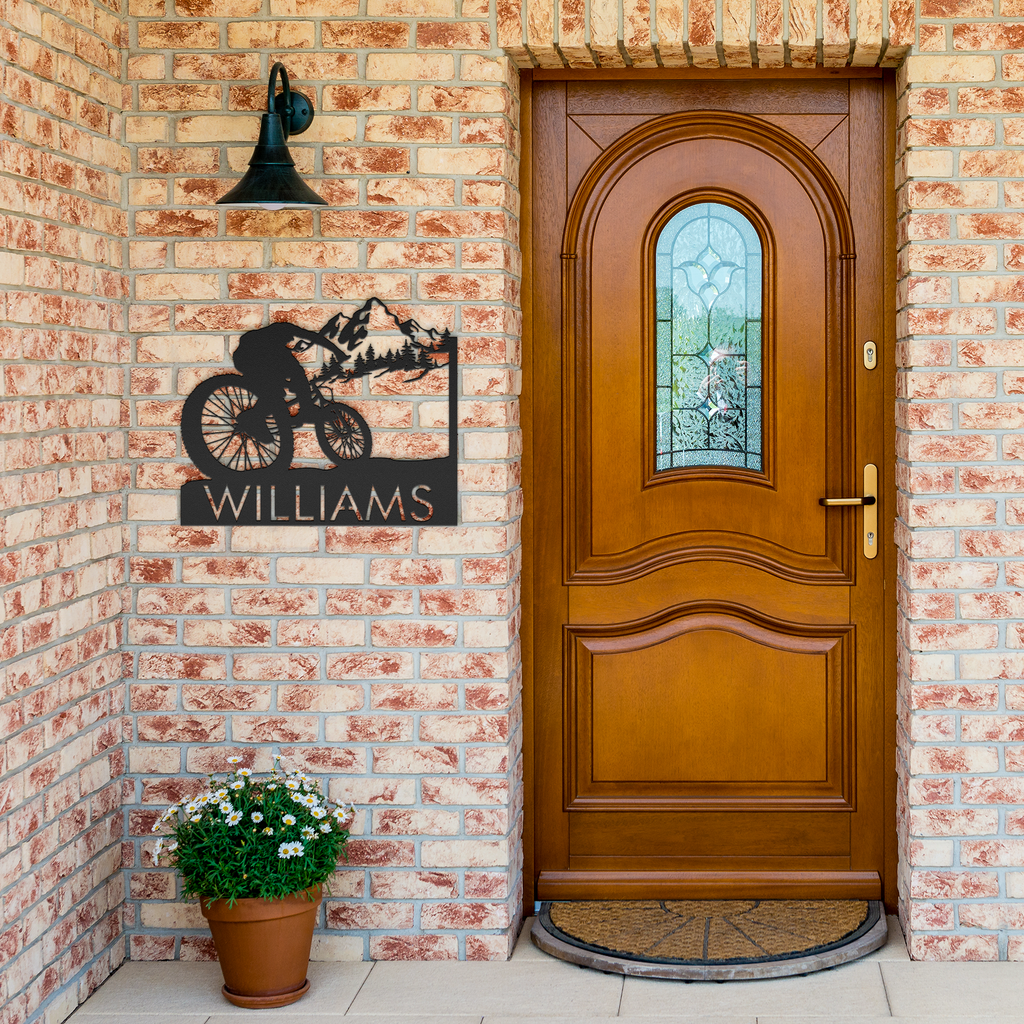 Personalized_Mountain_Bike_Metal_Wall_De_Black_Brick_Entrance_Mockup.png
