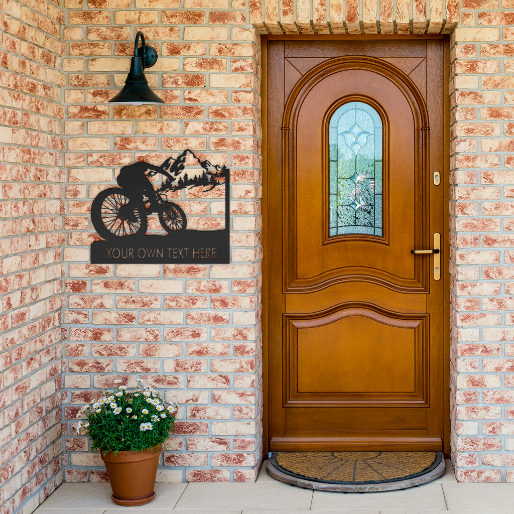Personalized_Mountain_Bike_Metal_Wall_De_Black_Brick_Entrance_Mockup.png